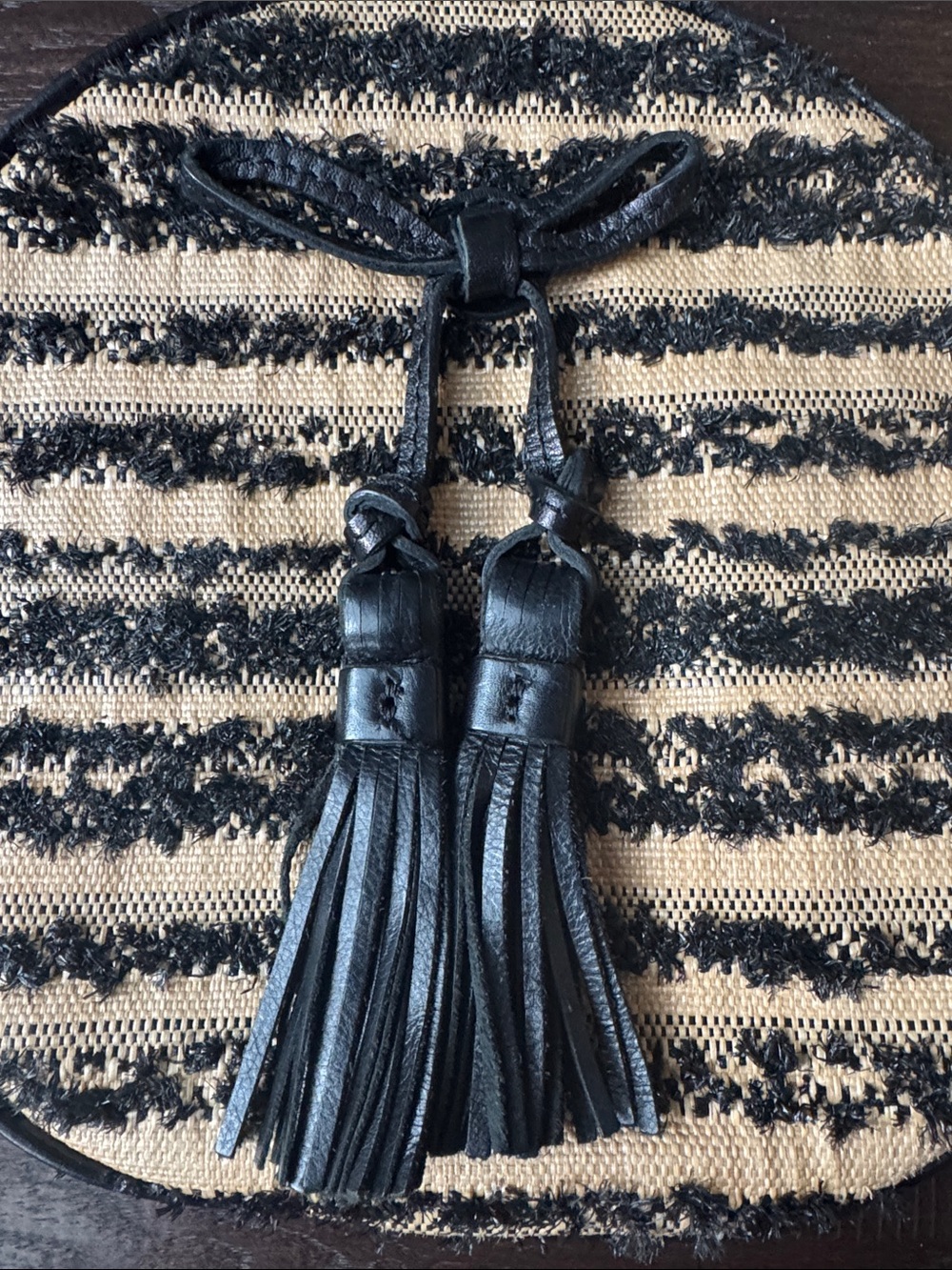 Patricia Nash Black and Natural Round Crossbody with Tassels - Picture 2 of 5